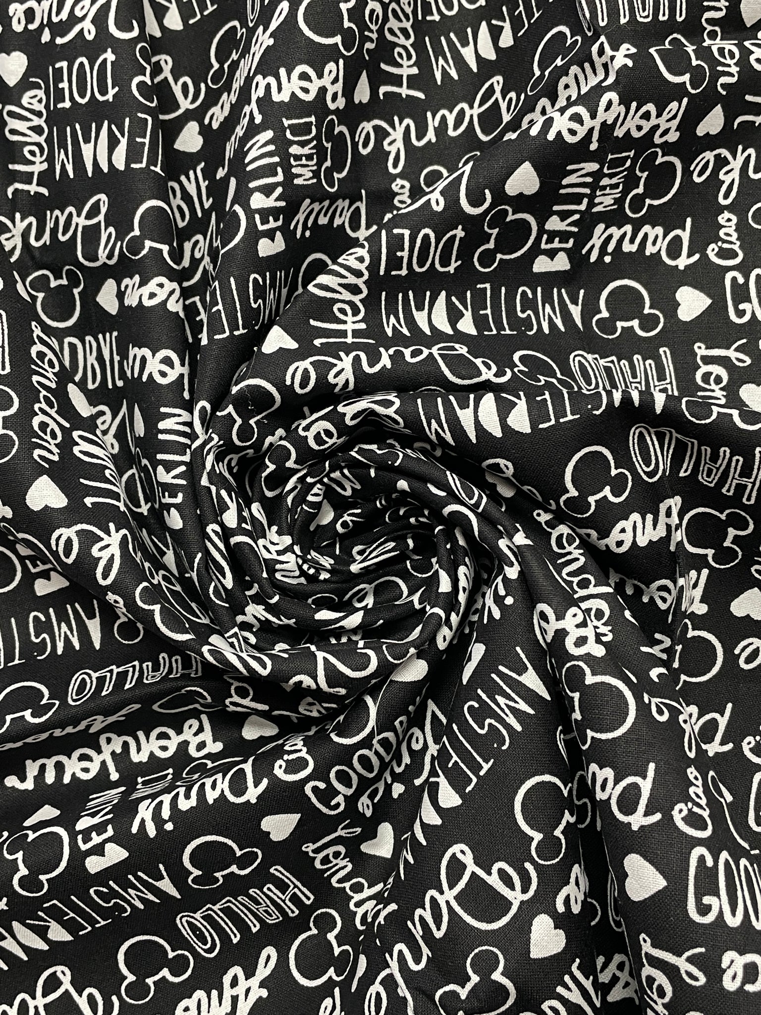 3/4 YD Quilting Cotton Remnant - Black with White Disney Writing