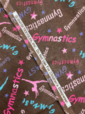 2 YD Cotton Flannel - Brown with Gymnastic Graphics