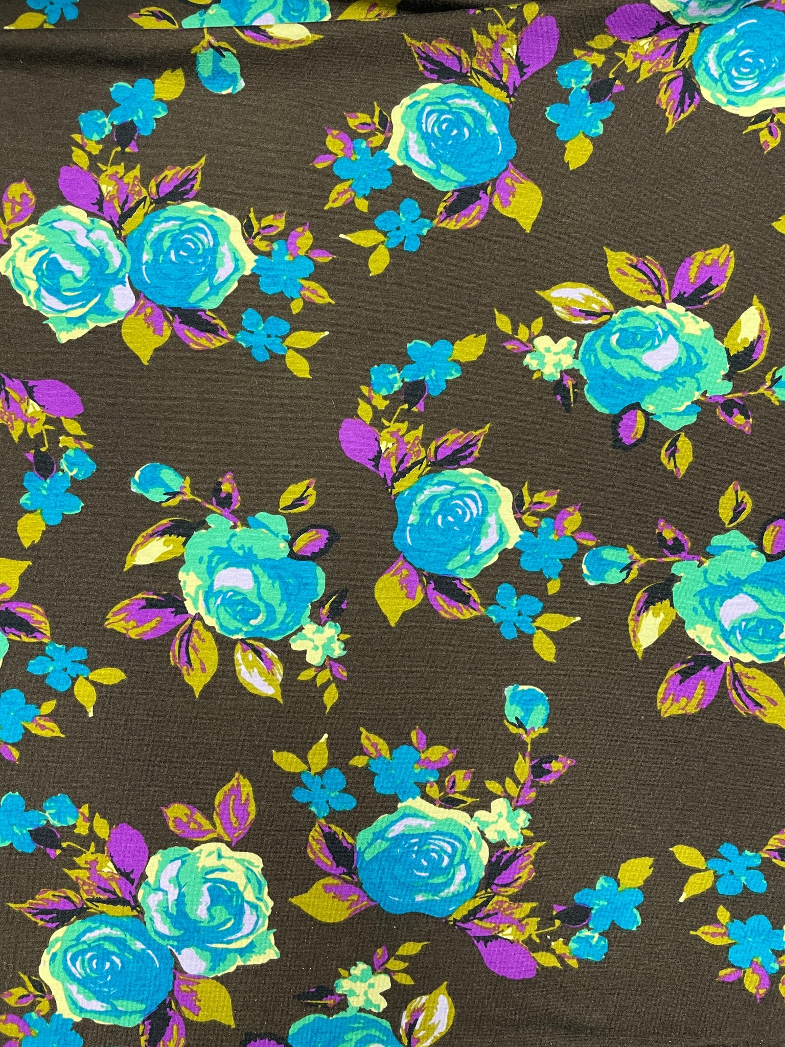 1 3/4 YD Nylon Knit - Turquoise and Green Roses with Purple and Khaki Green Leaves on Dark Brown