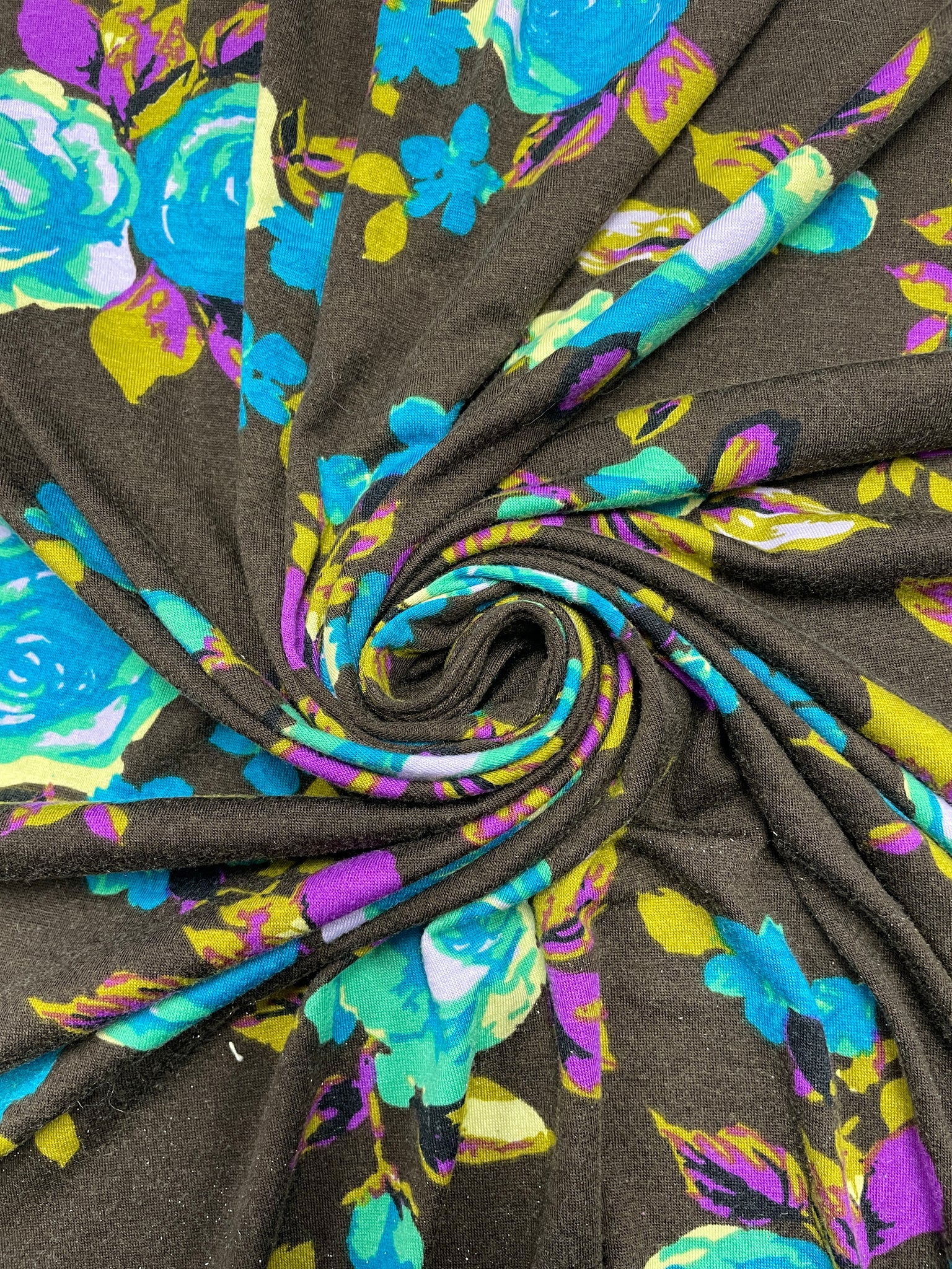 1 3/4 YD Nylon Knit - Turquoise and Green Roses with Purple and Khaki Green Leaves on Dark Brown