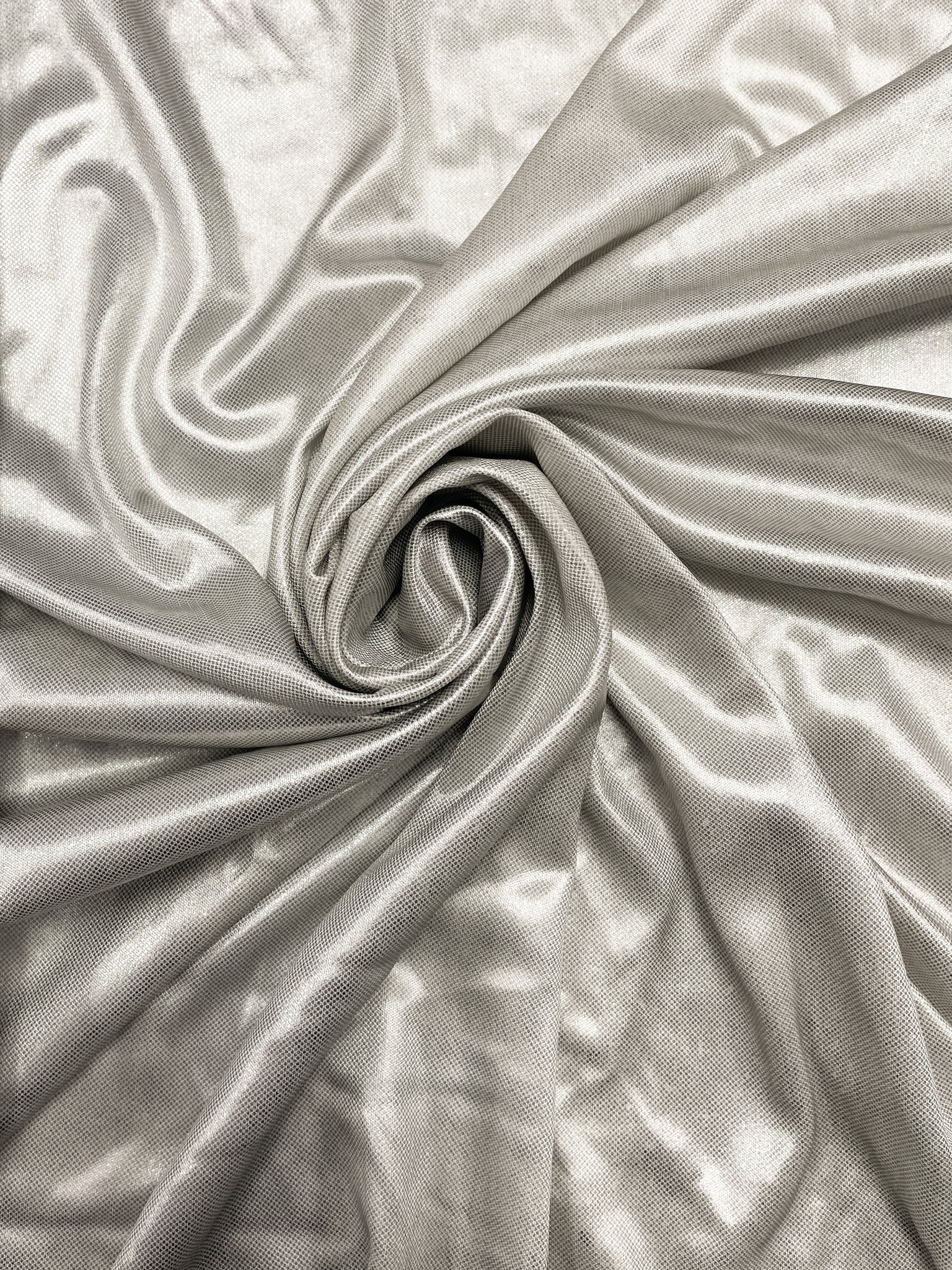 1 1/4 YD Polyester Metallic Knit - Iridescent Silver