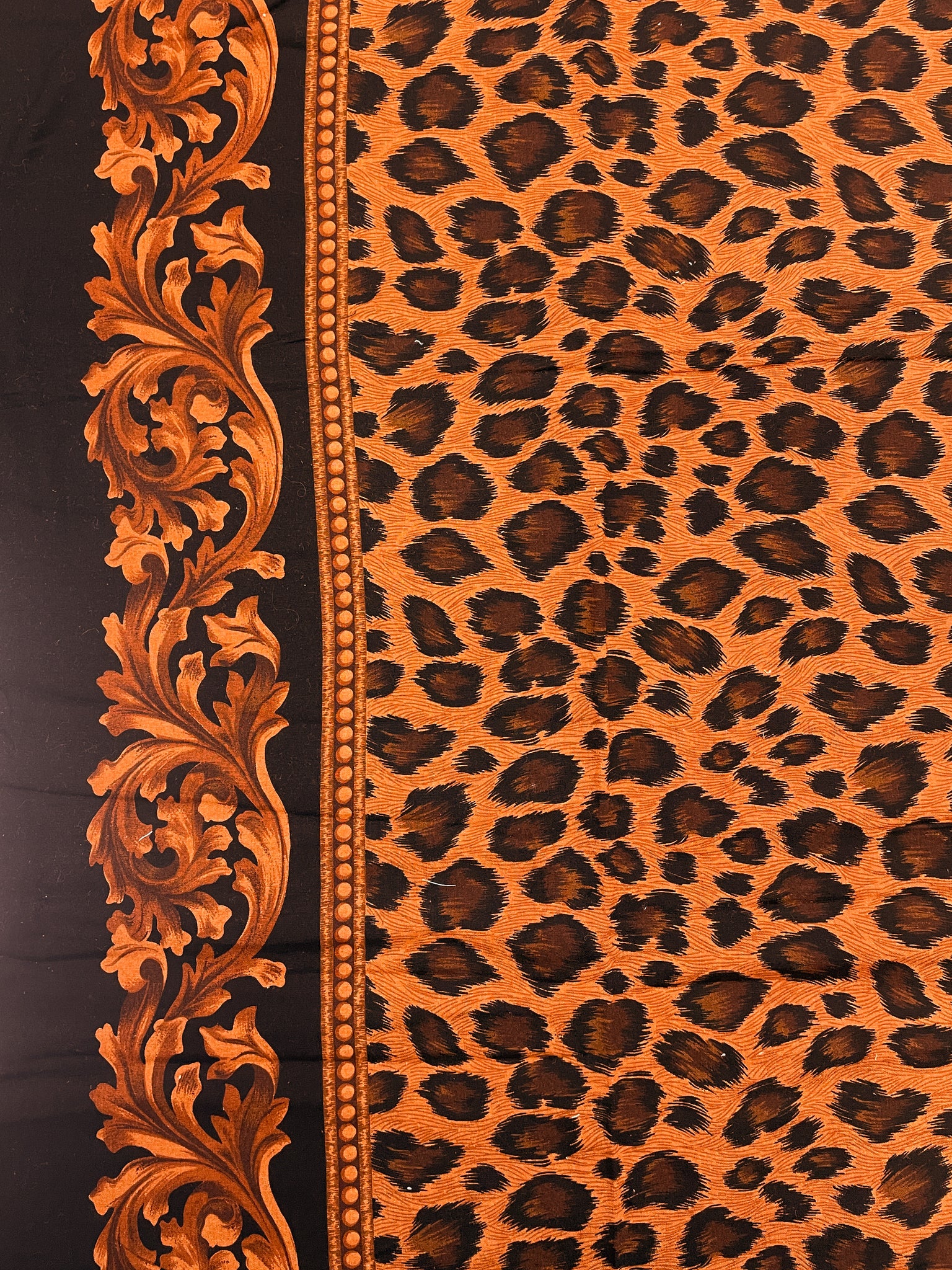 1 7/8 YD Rayon - Black and Orange Cheetah Print with a Filigree Border