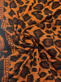 1 7/8 YD Rayon - Black and Orange Cheetah Print with a Filigree Border