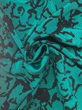 1 YD Nylon - Green with Abstract Black Flowers