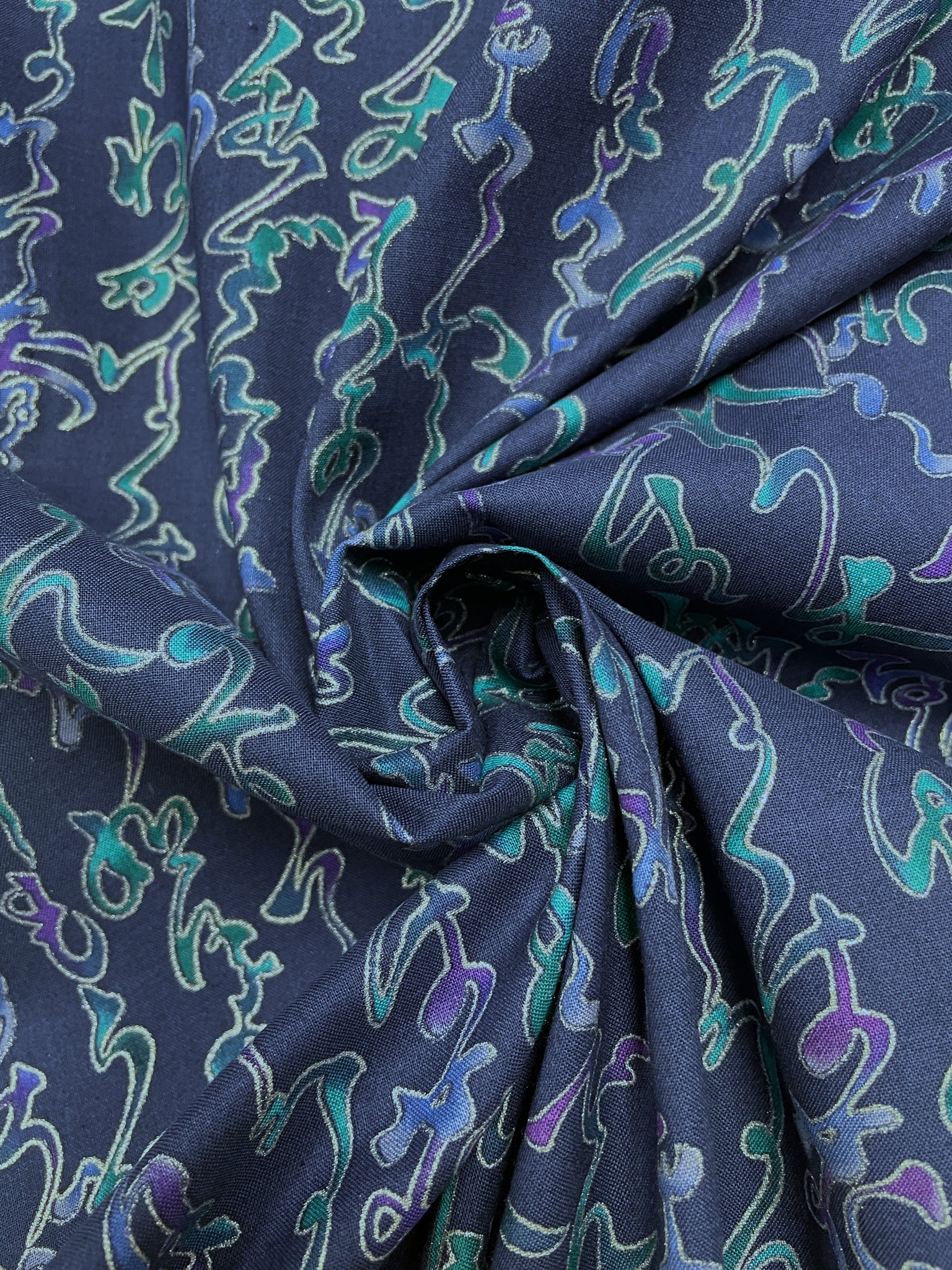 Quilting Cotton Vintage - Navy Blue with Mottled purple, Blue and teal Squiggles Outlined in Metallic Silver