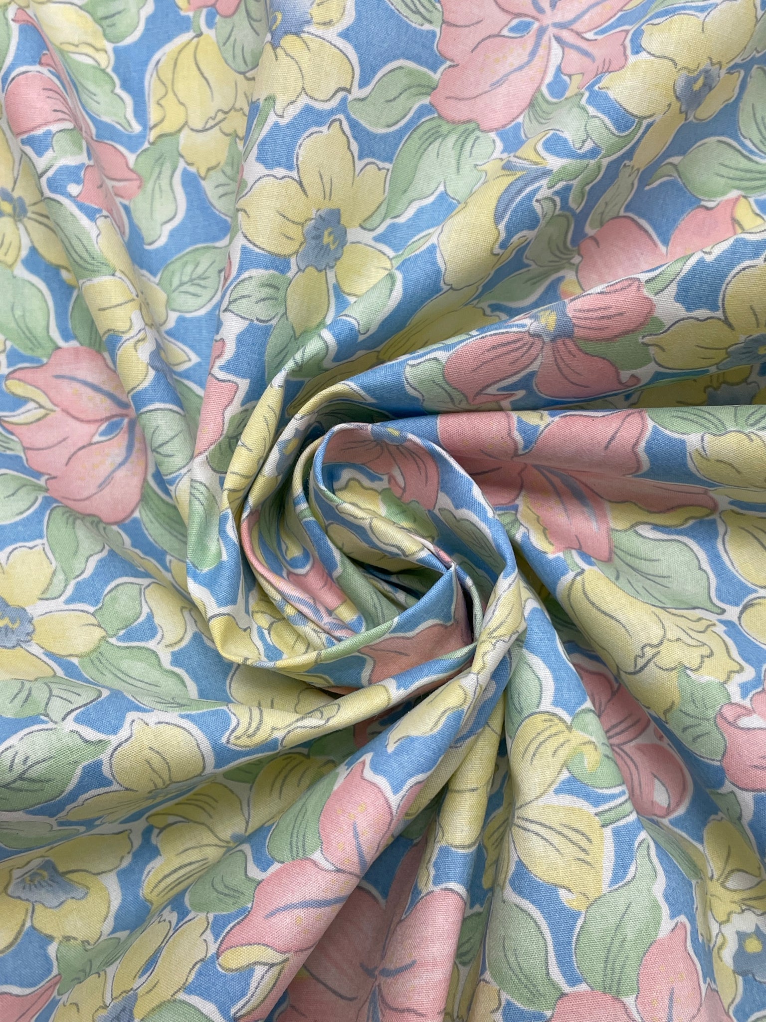 Poly/Cotton Vintage -Pink and Yellow Flowers with Green Leaves on Blue Background