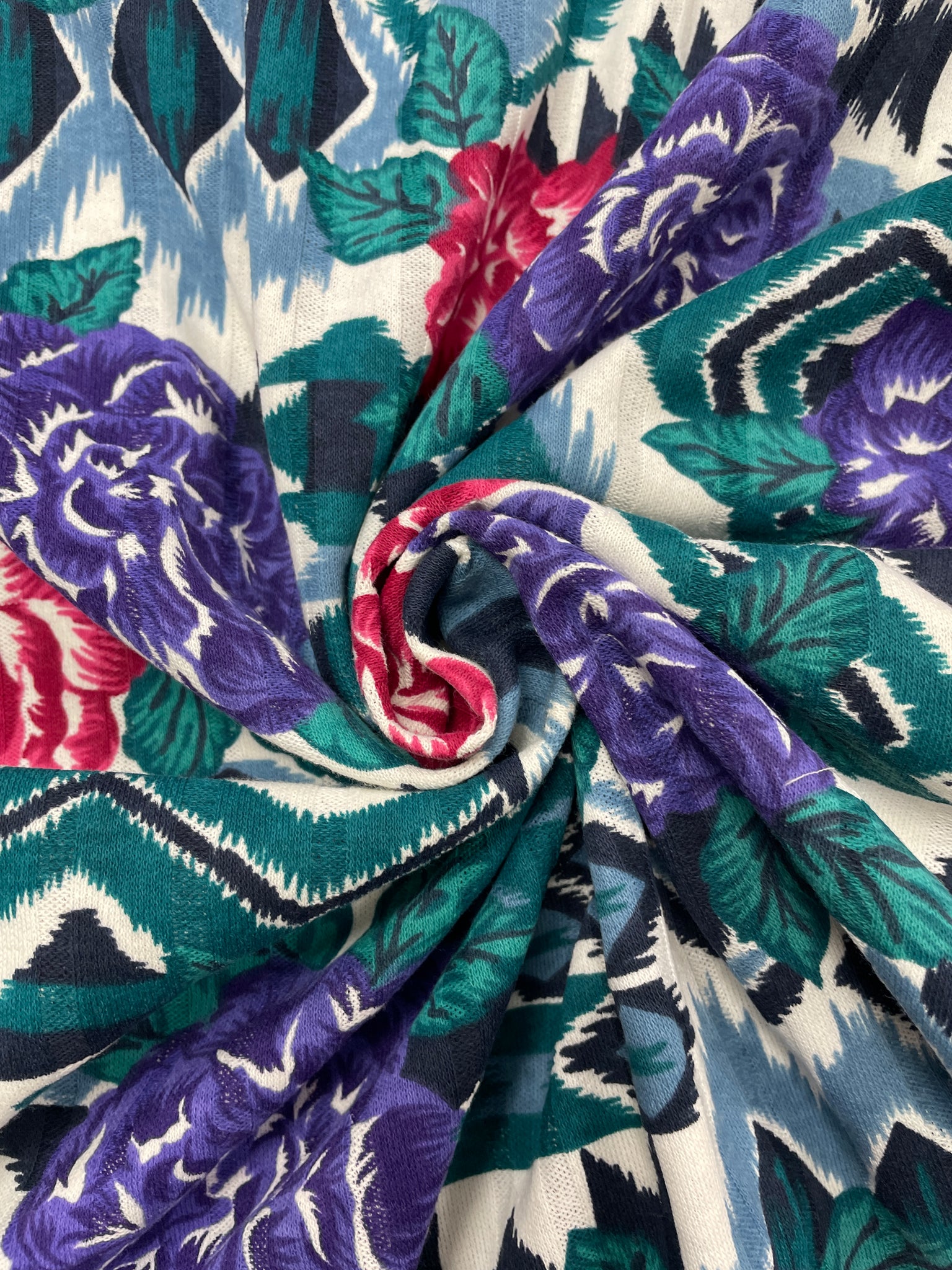 1 YD Poly/Cotton Knit with Self Stripe Vintage - Flowers in Red and Purple Over Southwestern Style Graphics in Green, Blue and Black