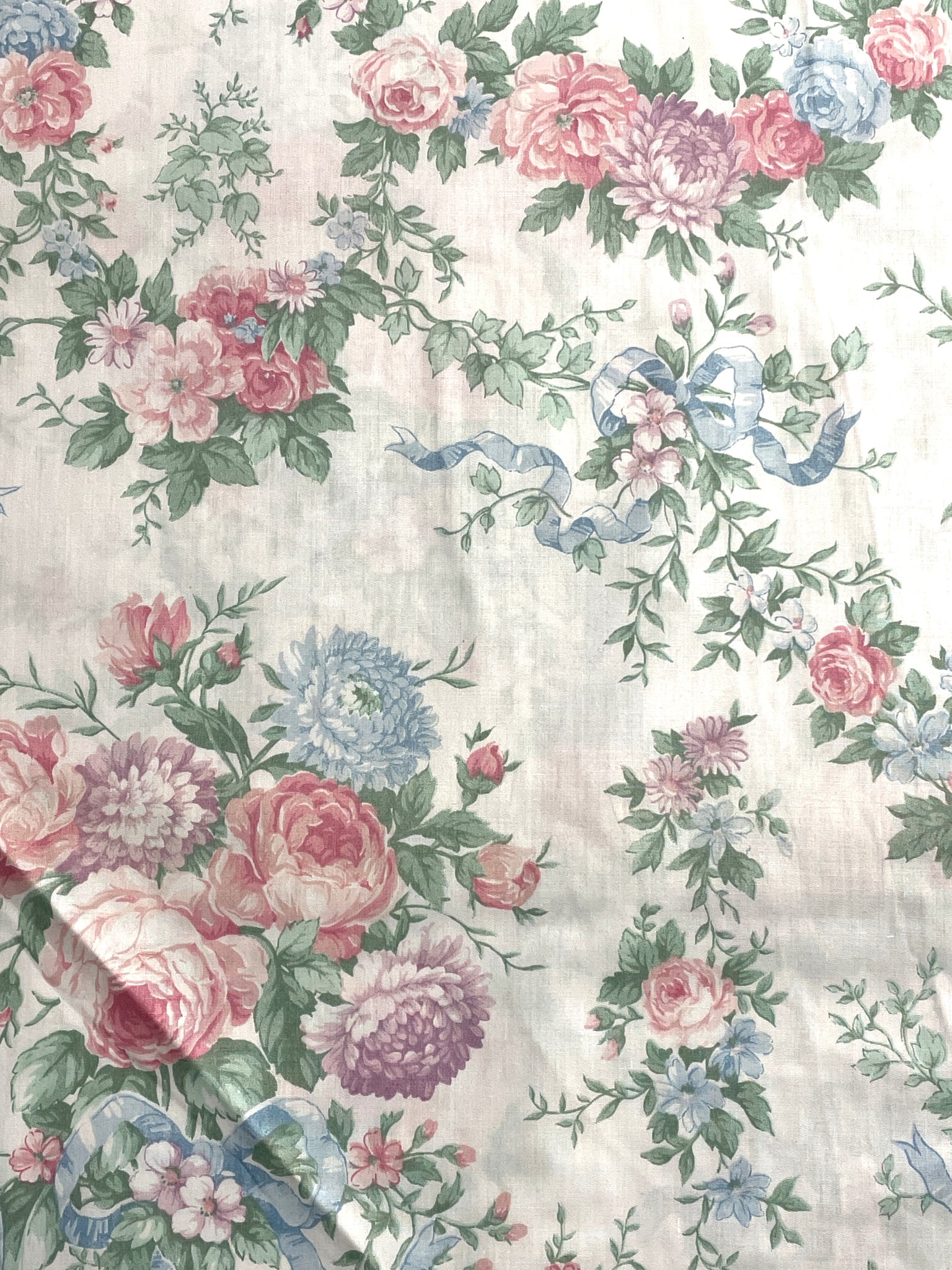 Poly/Cotton Vintage - White with Flowers in Pink, Blue and Purple with Tied in Blue Bows