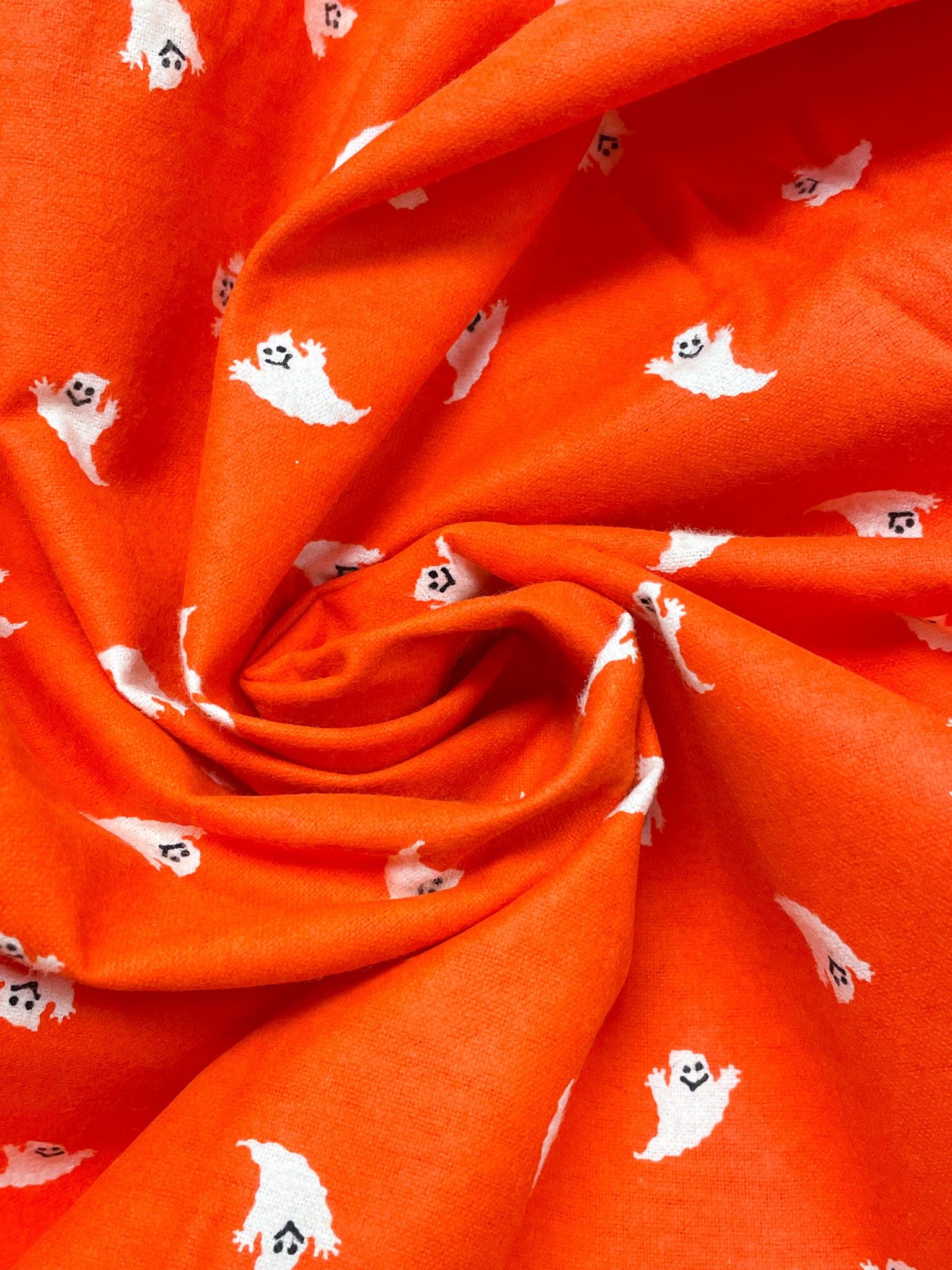 4 YD Cotton Flannel - Bright Orange with White Ghosts
