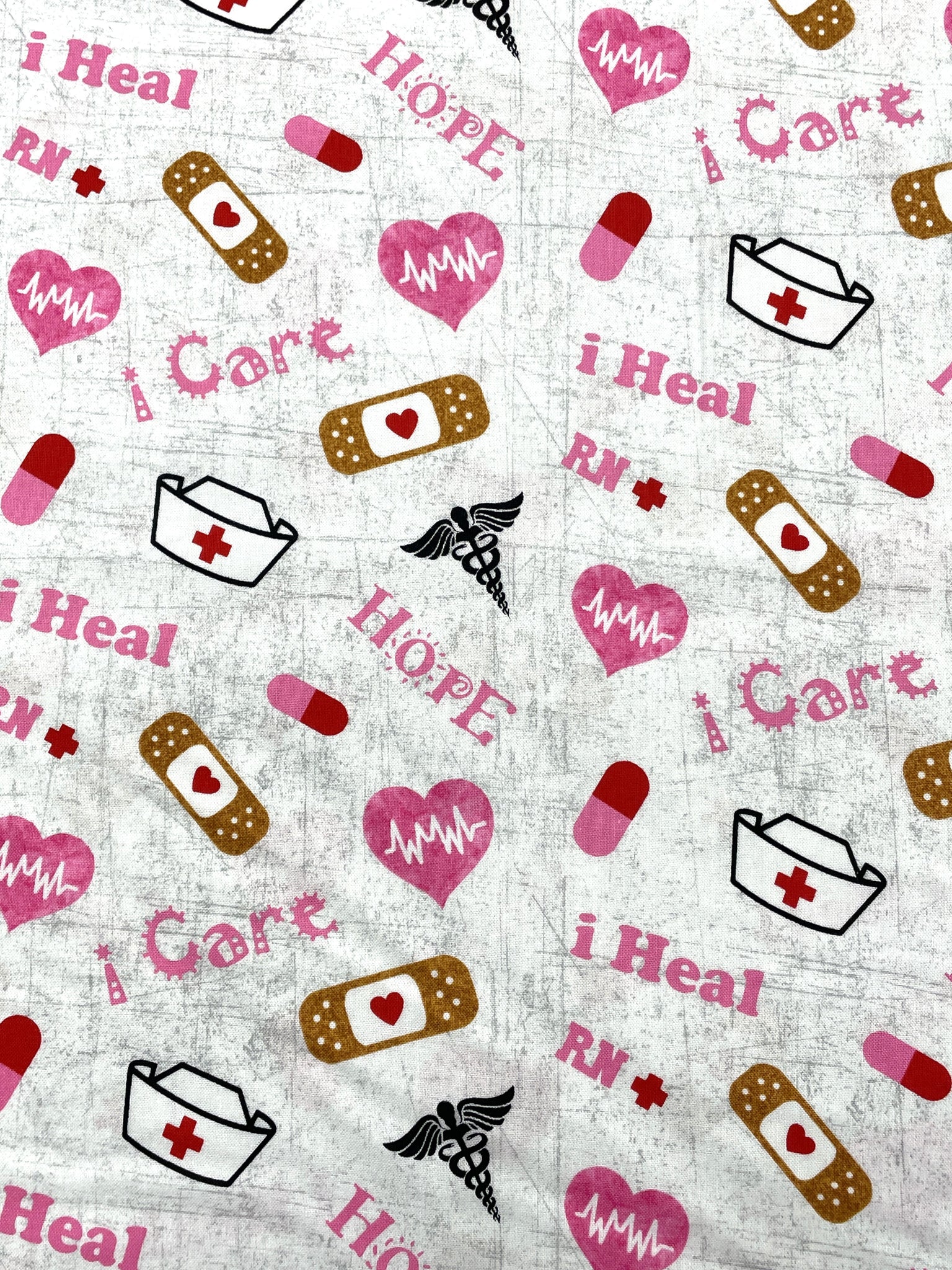 Quilting Cotton - White with Red and Pink Nurse Items and Black Caducei