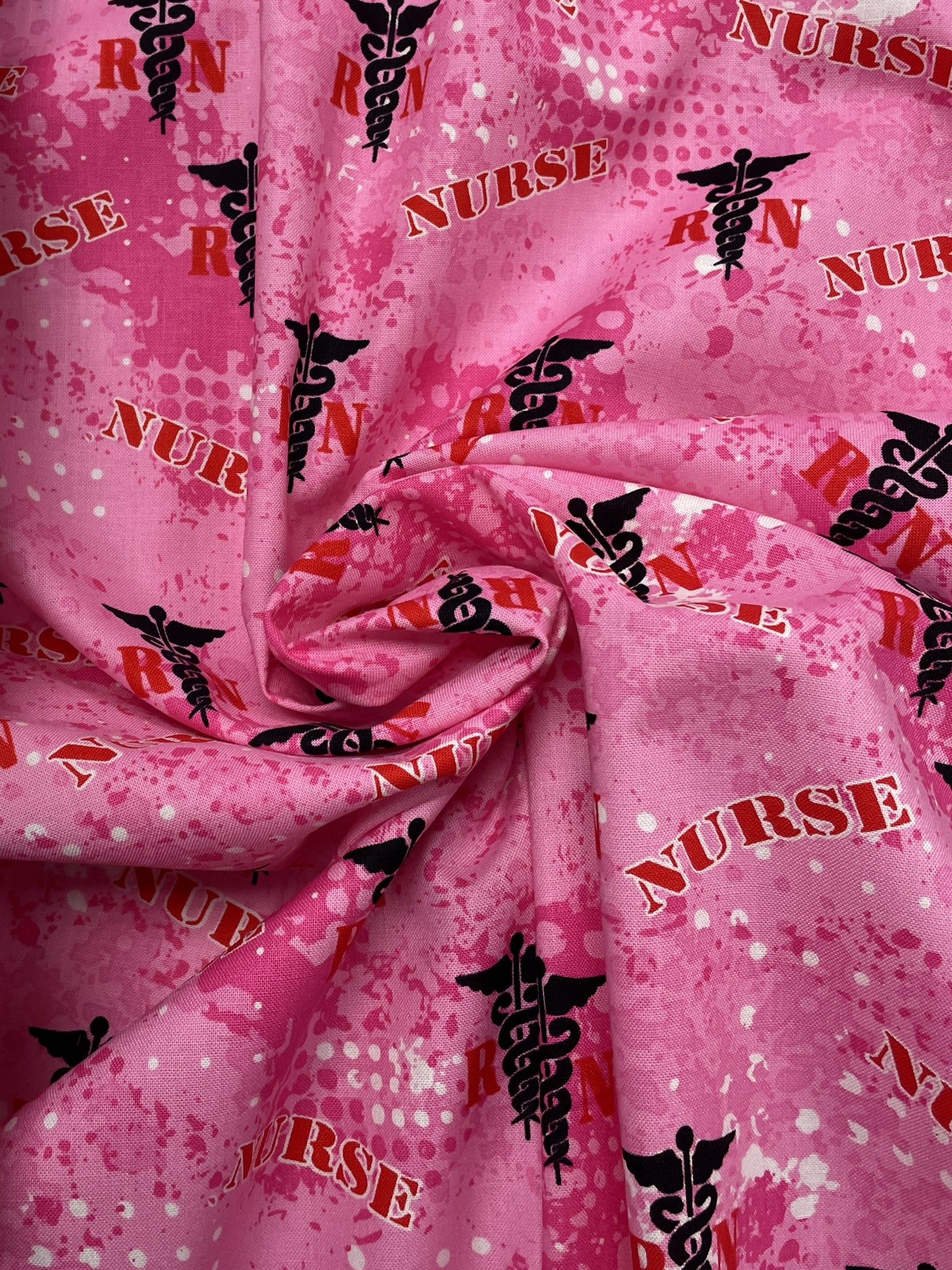 Quilting Cotton - Mottled Hot Pink with "Nurse" and "RN" in Red and Caducei in Black