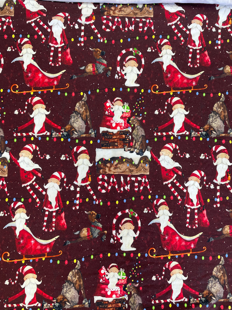 3/4 YD Cotton/Spandex Remnant - Maroon with Whimsical Santas & Reindeer
