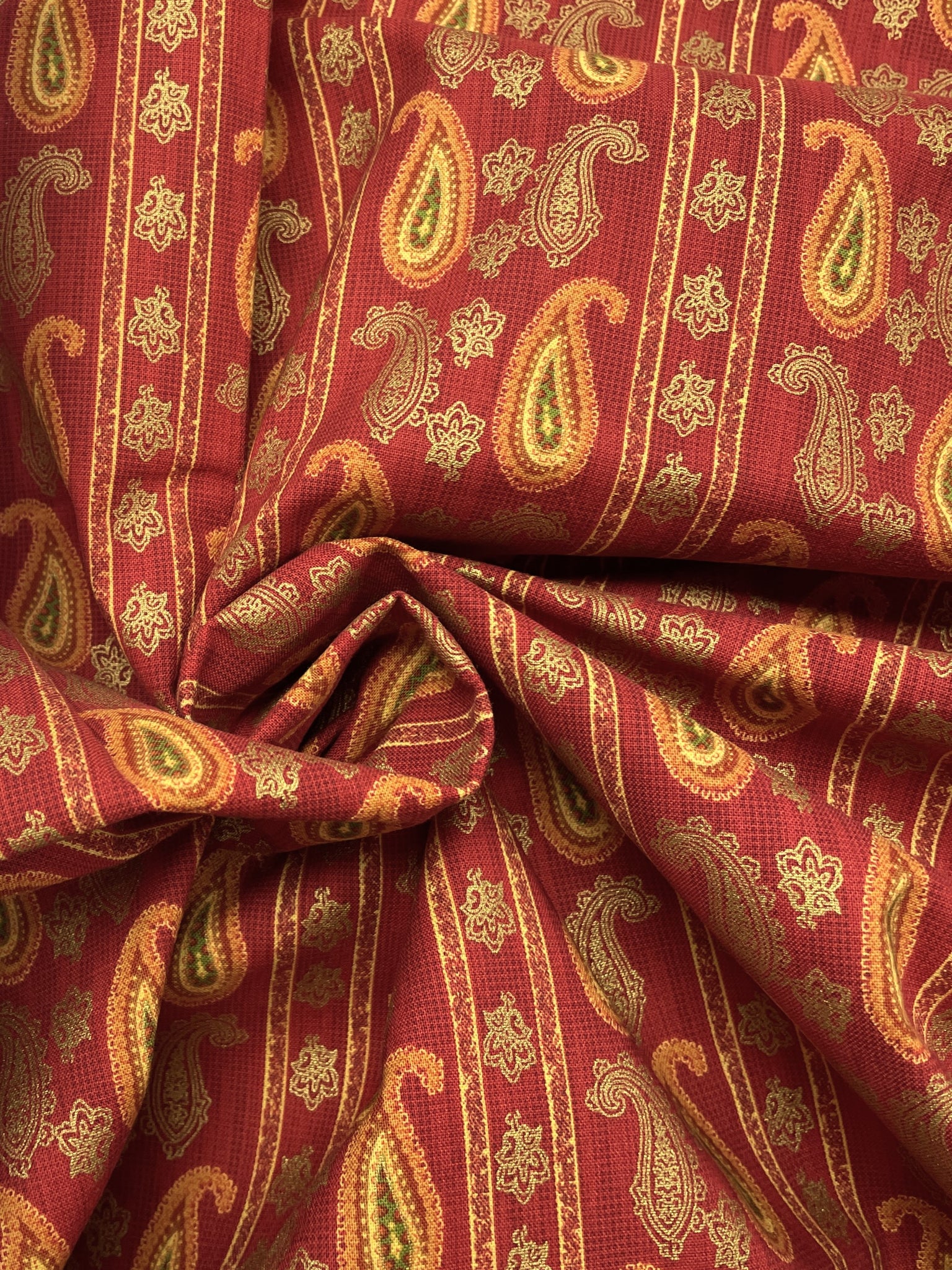 1 5/8 YD Quilting Cotton - Dark Red with Stripes of Paisley in Orange, Yellow and Metallic Gold Accents