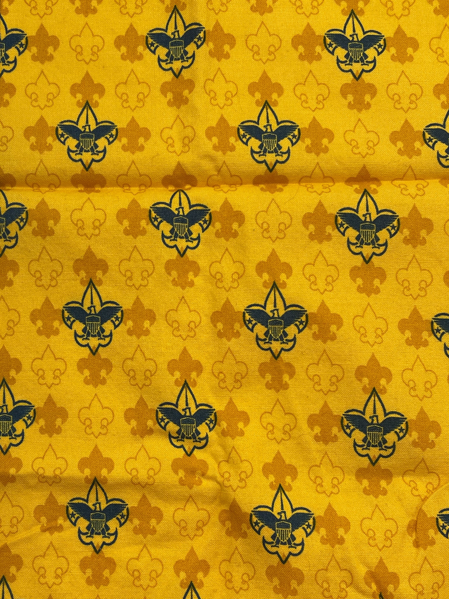 Quilting Cotton - Golden Yellow with Navy Blue Scout Boy Insignias