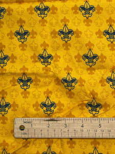 Quilting Cotton - Golden Yellow with Navy Blue Scout Boy Insignias