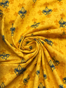 Quilting Cotton - Golden Yellow with Navy Blue Scout Boy Insignias