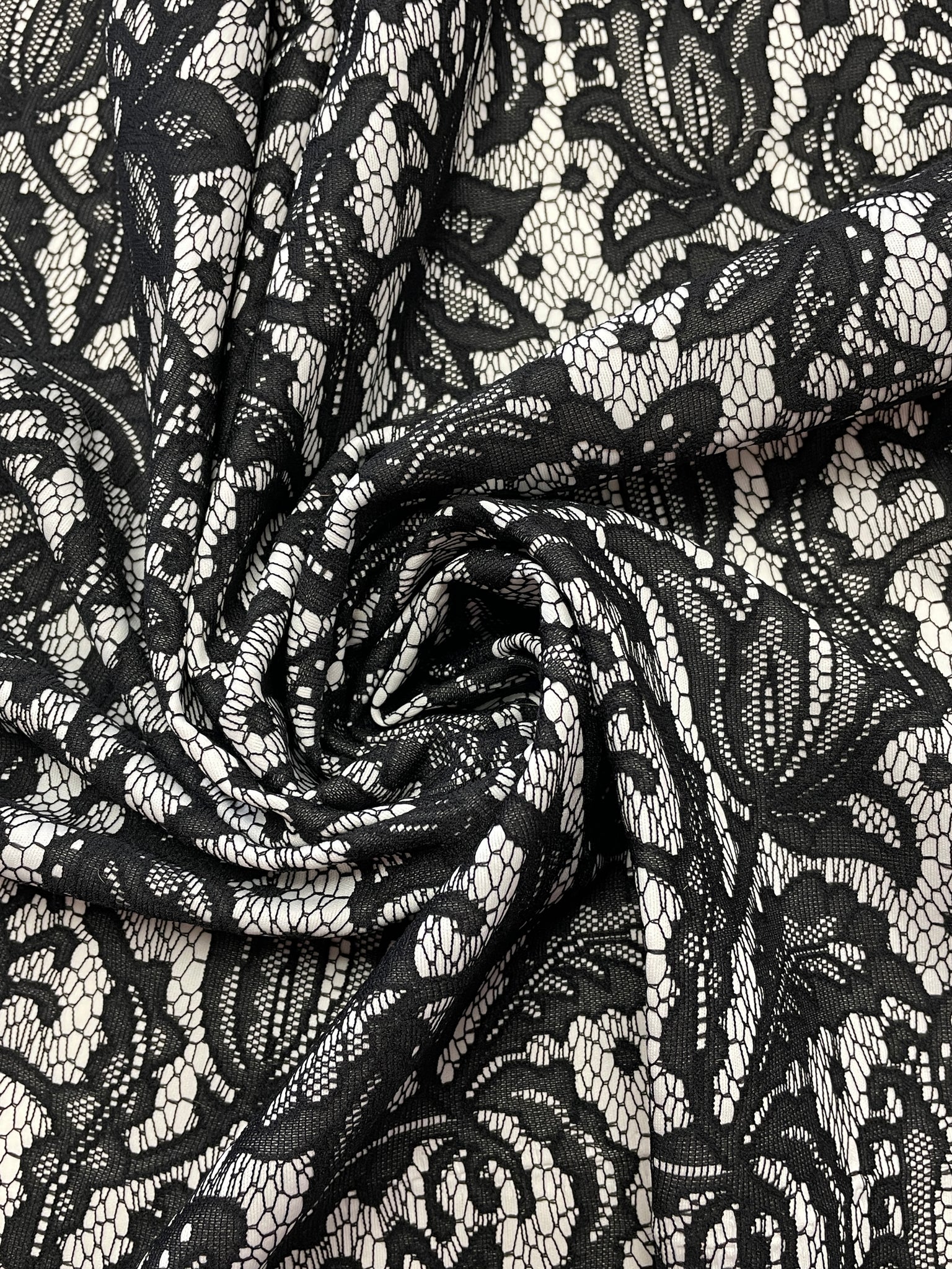 7/8 YD Polyester Knit Remnant - Black Knit Lace on White Knit